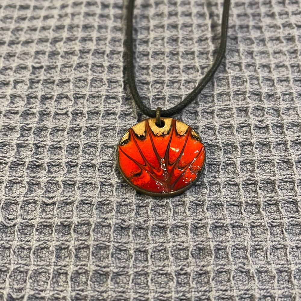 Coin pendant with cord necklace